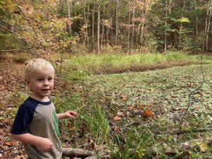 Cooper next to our hidden spring fed pond