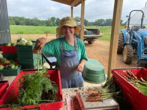 Anna, bunching carrots on a busy harvest day