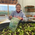 Guin, Josephine's mom, bagging salad mix