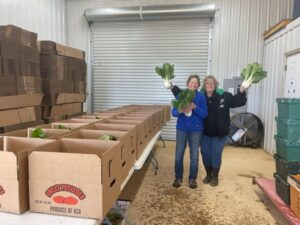 The moms, Guin (L) and Connie (R) helping pack the CSA