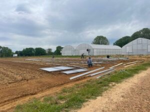 High tunnel build squaring the corner posts