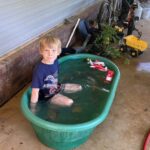 It's not all hot work. Here is Cooper hanging out in a water tub