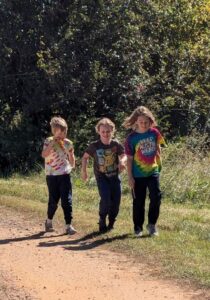 Cooper, (L), Guy, (C) and Oscar, (R) on a walk around the farm