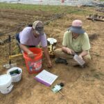 Raquel (L) and Shelby (R) seeding carrots, beets and more.