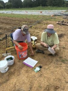 Raquel (L) and Shelby (R) seeding carrots, beets and more.