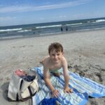 Cooper enjoying the beach in Wilmington