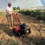 Josephine trying out our new DR walk behind tiller. These beds will have garlic planted in them by the end of the week.