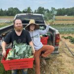 Hugh (L) and Katherine (R) showing off the freshly harvested kohlrabi