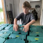 Cooper closing up some CSA boxes