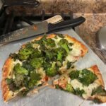 Broccoli, kale and pickled Hungarian peppers on a cheap cheese pizza equals farm dinner