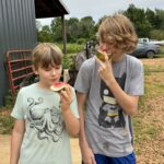 Cooper (L) and his friend Guage enjoying some fresh watermelon.