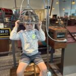 Cooper trying out some "quack" medicine machines at the Science Museum of Minnesota.