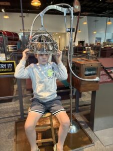 Cooper trying out some "quack" medicine machines at the Science Museum of Minnesota.