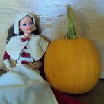 $200 pumpkin next to Pilgrim Barbie for scale