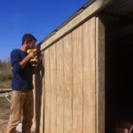 Chris Peterson working on the goat hut