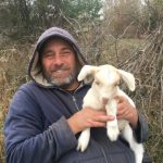 Randy Alexander of Tubby Creek Farm with a baby Kiko Cross Goat