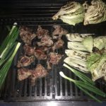 Grilled goat chops, onions and cabbage