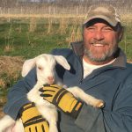 Randy holding one of our young goats