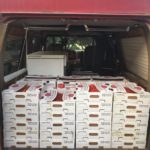 Tomatoes loaded for market more than 50 10 pound boxes