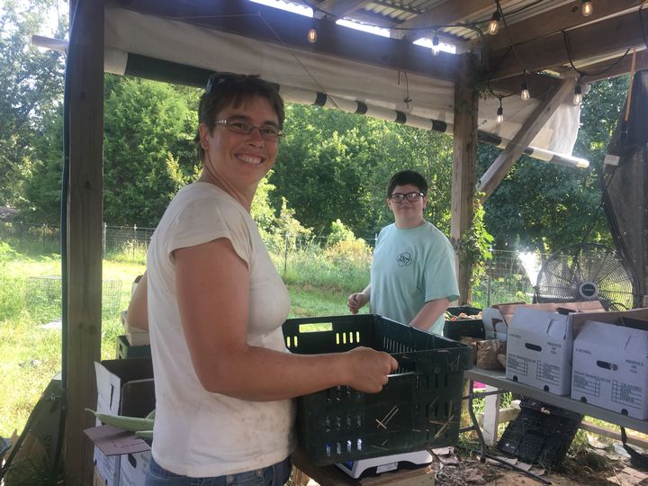 Josephine & Sarah packing CSA boxes